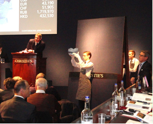 Christie's European President Jussi Pylkkanen (far right) keeps an eye on the action at Christie's London sale of Russian art on 26 November. Image Auction Central News. 